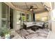 Covered patio features ample seating, an outdoor ceiling fan, and decorative string lights at 4524 E Narrowleaf Dr, Gilbert, AZ 85298
