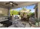 Covered patio with outdoor seating, a ceiling fan, and a built-in BBQ area, perfect for entertaining at 4524 E Narrowleaf Dr, Gilbert, AZ 85298