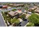 An aerial view showcases a well-maintained two-story home with a landscaped yard in a suburban neighborhood at 5016 S Curie Way, Mesa, AZ 85212