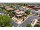 Aerial view showcasing a well-maintained two-story home in a residential area with landscaped yards and nearby amenities at 5016 S Curie Way, Mesa, AZ 85212