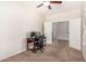 Bedroom boasts neutral walls, carpet flooring and a ceiling fan for comfortable climate control at 5016 S Curie Way, Mesa, AZ 85212
