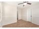 Bedroom boasts neutral walls, carpet flooring and a ceiling fan for comfortable climate control at 5016 S Curie Way, Mesa, AZ 85212
