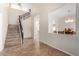 Spacious entryway with tile floors, staircase, and view of the dining area at 5016 S Curie Way, Mesa, AZ 85212