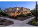 Inviting two-story home featuring a covered porch with decorative columns and a neatly landscaped front yard and walkway at 5016 S Curie Way, Mesa, AZ 85212