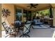 Outdoor patio features a dining area, lounge area, and built in grill at 5437 W Red Bird Rd, Phoenix, AZ 85083