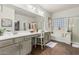 The spacious bathroom features dual sinks, a makeup vanity, bathtub, and separate shower at 5437 W Red Bird Rd, Phoenix, AZ 85083