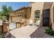 Private courtyard with wrought-iron gate features seating and offers a cozy outdoor living space at 5437 W Red Bird Rd, Phoenix, AZ 85083