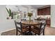 Dining area with open layout features a view into both the living room and kitchen at 5437 W Red Bird Rd, Phoenix, AZ 85083