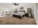 The main bedroom has a ceiling fan and attached office area at 5437 W Red Bird Rd, Phoenix, AZ 85083