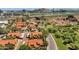 Aerial view of a community with a pool, desert landscape, and tile roofs at 609 E Mesquite Cir # D132, Tempe, AZ 85288