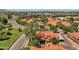Aerial view of a neighborhood with tile roofs, trees, and manicured lawns at 609 E Mesquite Cir # D132, Tempe, AZ 85288