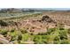 Scenic aerial view with green park space below, native desert landscape, river, freeway, and mountains in the distance at 609 E Mesquite Cir # D132, Tempe, AZ 85288