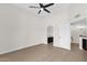 Bedroom with neutral walls and wood-look flooring, large window, and full bath at 609 E Mesquite Cir # D132, Tempe, AZ 85288