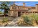 Charming townhome featuring a desert-landscaped front yard and a classic tile roof at 609 E Mesquite Cir # D132, Tempe, AZ 85288