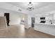Stylish open-concept kitchen featuring white cabinetry, modern appliances, and a breakfast bar at 609 E Mesquite Cir # D132, Tempe, AZ 85288
