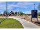 Community park featuring a playground, swings, and lush green grass for recreational activities at 609 E Mesquite Cir # D132, Tempe, AZ 85288