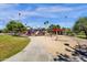 Community playground featuring colorful play structures, slides, and climbing areas in a park setting at 609 E Mesquite Cir # D132, Tempe, AZ 85288