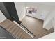 Modern staircase featuring gray toned wood flooring, black accents, and a window at 609 E Mesquite Cir # D132, Tempe, AZ 85288