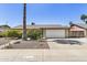 Charming single-story home featuring a well-maintained front yard and two-car garage at 6605 W Altadena Ave, Glendale, AZ 85304