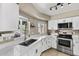 Bright kitchen featuring white countertops, cabinets and stainless steel appliances at 6605 W Altadena Ave, Glendale, AZ 85304