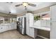 Well-lit kitchen with white cabinets and stainless steel appliances at 6605 W Altadena Ave, Glendale, AZ 85304