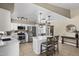 Open kitchen featuring an island with seating and stainless steel appliances at 6605 W Altadena Ave, Glendale, AZ 85304