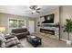 Cozy living room with a stone fireplace and comfortable seating at 6605 W Altadena Ave, Glendale, AZ 85304