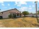 A spacious backyard featuring a covered patio and mature landscaping at 6719 W Sack Dr, Glendale, AZ 85308