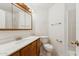 Clean bathroom featuring a vanity with a sink, toilet, and shower at 6719 W Sack Dr, Glendale, AZ 85308