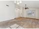 Bright living room features a ceiling fan and a window with plantation shutters at 6719 W Sack Dr, Glendale, AZ 85308