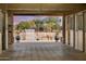 Interior view of barn with outdoor horse area and landscaping beyond at 6861 W Calle Lejos --, Peoria, AZ 85383