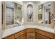 Bright bathroom boasts dual mirrors, tiled countertops, and a well-lit shower area, exuding elegance and functionality at 6861 W Calle Lejos --, Peoria, AZ 85383