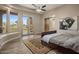 Bright bedroom featuring wood floors, large windows, and access to the backyard at 6861 W Calle Lejos --, Peoria, AZ 85383