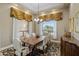 Elegant dining room with decorative lighting, large window, and ornate furnishings at 6861 W Calle Lejos --, Peoria, AZ 85383