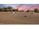 Outdoor equestrian area with a dirt surface and various equestrian training jumps at 6861 W Calle Lejos --, Peoria, AZ 85383
