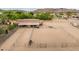 Aerial view of the horse property and barn with equestrian area and fencing at 6861 W Calle Lejos --, Peoria, AZ 85383