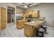 Well-appointed kitchen with wood cabinets, granite countertops, and stainless steel appliances at 6861 W Calle Lejos --, Peoria, AZ 85383