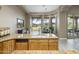 Kitchen view displaying granite countertops, wood cabinets, and an open view to the yard at 6861 W Calle Lejos --, Peoria, AZ 85383