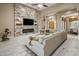 Inviting living room with stone accent wall, fireplace, and access to formal dining at 6861 W Calle Lejos --, Peoria, AZ 85383