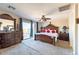 Spacious neutral bedroom featuring a decorative headboard and a sliding glass door at 7102 W Pueblo Ave, Phoenix, AZ 85043