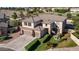 A well-manicured two-story home with a three-car garage, desert landscaping, and lawn at 7102 W Pueblo Ave, Phoenix, AZ 85043