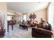 Bright and open living room with tile flooring, a comfortable sofa and decor at 7102 W Pueblo Ave, Phoenix, AZ 85043