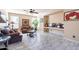 Cozy living room with tile flooring, a comfortable sofa, and a television at 7102 W Pueblo Ave, Phoenix, AZ 85043