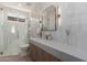 Modern bathroom featuring a glass-enclosed shower, floating vanity, and stylish fixtures at 7710 E Tardes Dr, Scottsdale, AZ 85255