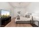 Cozy bedroom features neutral color palette, TV, and dresser creating a soothing retreat at 7710 E Tardes Dr, Scottsdale, AZ 85255