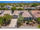 Charming home with a circular tower feature, lush desert landscaping, and a welcoming three-car garage at 7710 E Tardes Dr, Scottsdale, AZ 85255