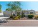 Charming single-story home featuring desert landscaping with drought-tolerant plants and a spacious two-car garage at 7710 E Tardes Dr, Scottsdale, AZ 85255