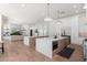 Open kitchen and living room space, featuring an island, stainless steel appliances, and plenty of storage at 7710 E Tardes Dr, Scottsdale, AZ 85255
