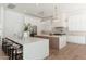 Spacious kitchen with white cabinetry, quartz countertops, dual islands, and stainless steel appliances at 7710 E Tardes Dr, Scottsdale, AZ 85255