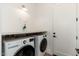 Well-lit laundry room with LG washer and dryer and door to hall at 7710 E Tardes Dr, Scottsdale, AZ 85255